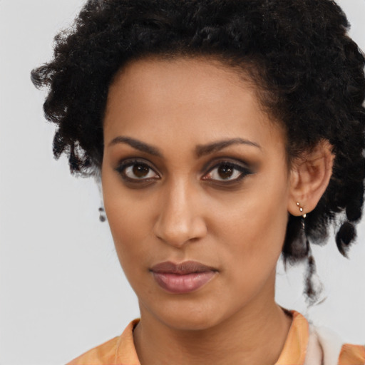 Neutral black young-adult female with medium  brown hair and brown eyes