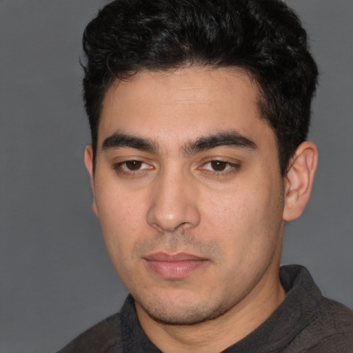 Neutral white young-adult male with short  black hair and brown eyes