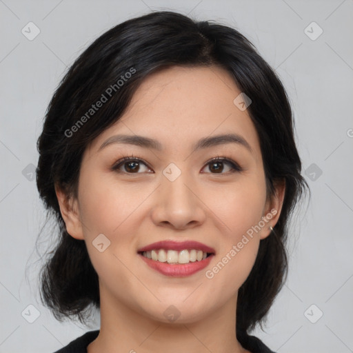 Joyful asian young-adult female with medium  black hair and brown eyes