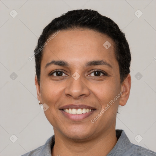 Joyful latino young-adult female with short  black hair and brown eyes