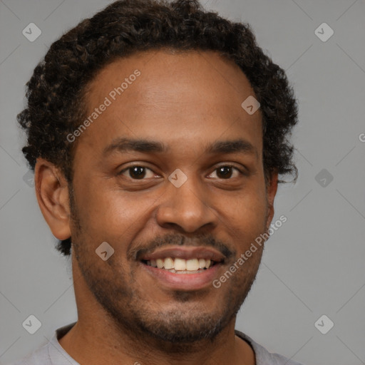 Joyful black young-adult male with short  brown hair and brown eyes