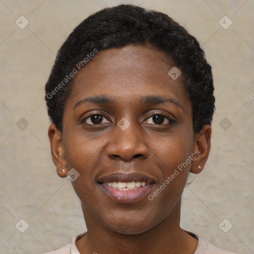 Joyful black young-adult female with short  brown hair and brown eyes