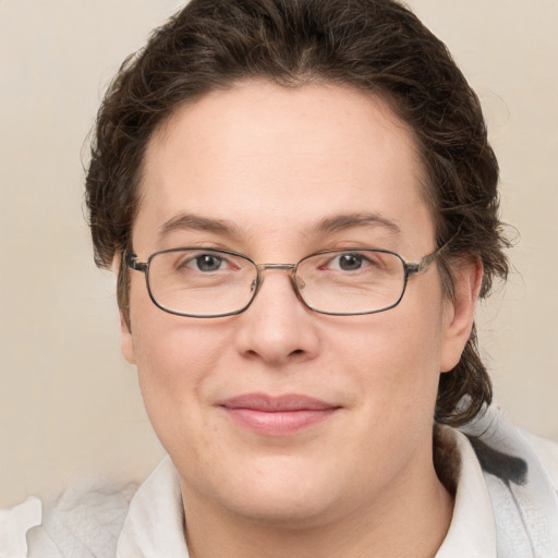 Joyful white young-adult female with medium  brown hair and green eyes