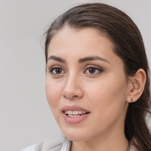 Joyful white young-adult female with medium  brown hair and brown eyes