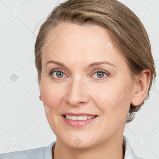 Joyful white adult female with medium  brown hair and grey eyes