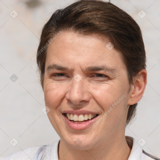 Joyful white adult female with short  brown hair and brown eyes