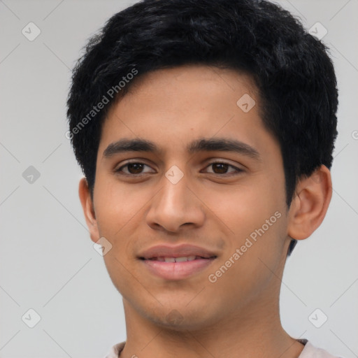 Joyful latino young-adult male with short  black hair and brown eyes