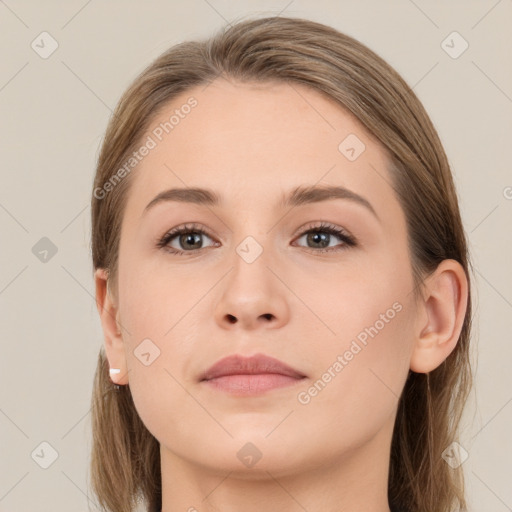 Neutral white young-adult female with long  brown hair and brown eyes