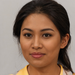 Joyful asian young-adult female with medium  brown hair and brown eyes