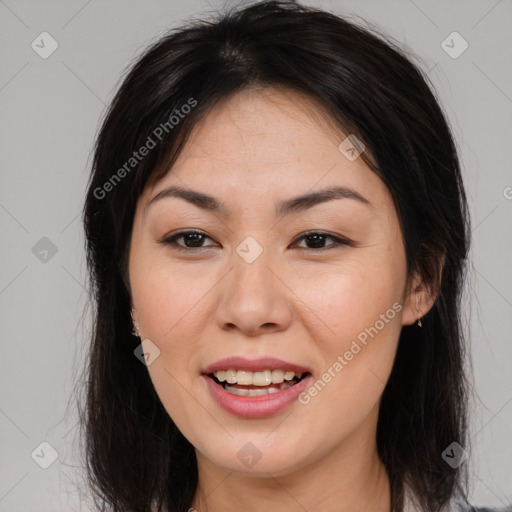 Joyful asian young-adult female with long  brown hair and brown eyes