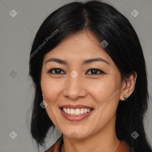 Joyful asian young-adult female with long  black hair and brown eyes