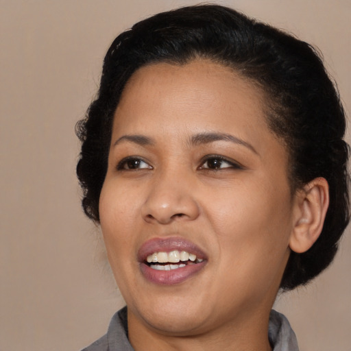 Joyful black young-adult female with medium  black hair and brown eyes