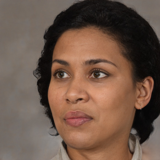 Neutral black young-adult female with medium  black hair and brown eyes