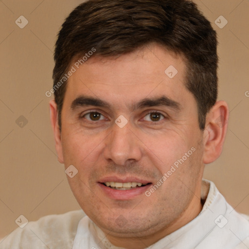 Joyful white adult male with short  brown hair and brown eyes