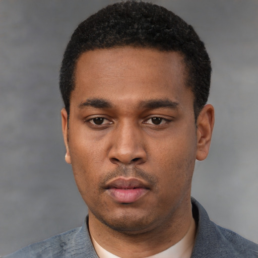 Neutral black young-adult male with short  black hair and brown eyes