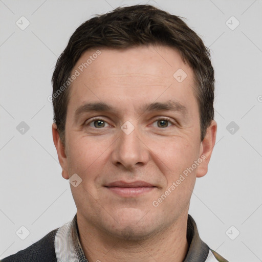 Joyful white adult male with short  brown hair and grey eyes