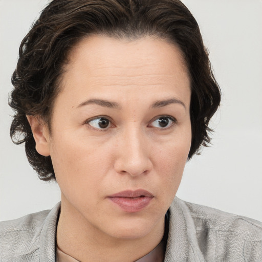 Neutral white adult female with short  brown hair and brown eyes