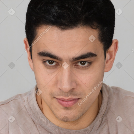 Joyful latino young-adult male with short  brown hair and brown eyes