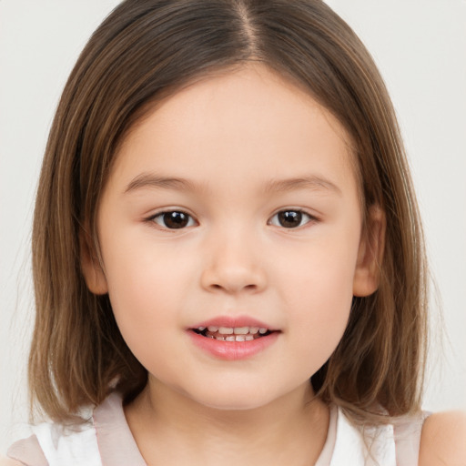 Joyful white child female with medium  brown hair and brown eyes