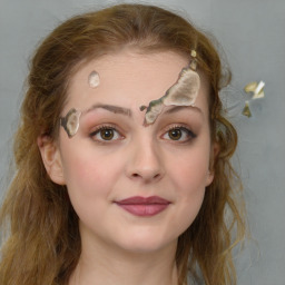 Joyful white young-adult female with long  brown hair and blue eyes