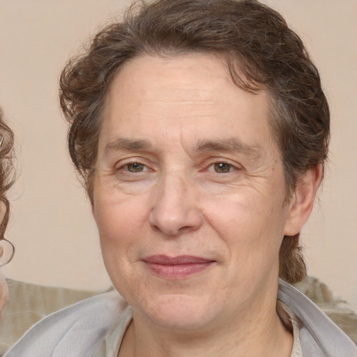 Joyful white middle-aged male with medium  brown hair and brown eyes