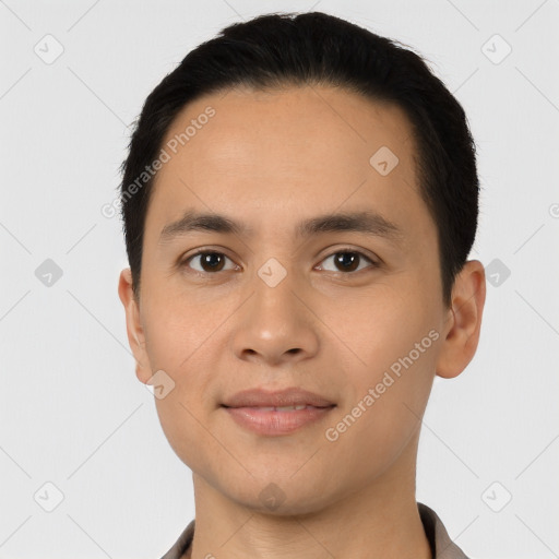 Joyful asian young-adult male with short  black hair and brown eyes