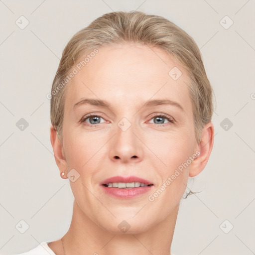 Joyful white adult female with short  brown hair and grey eyes