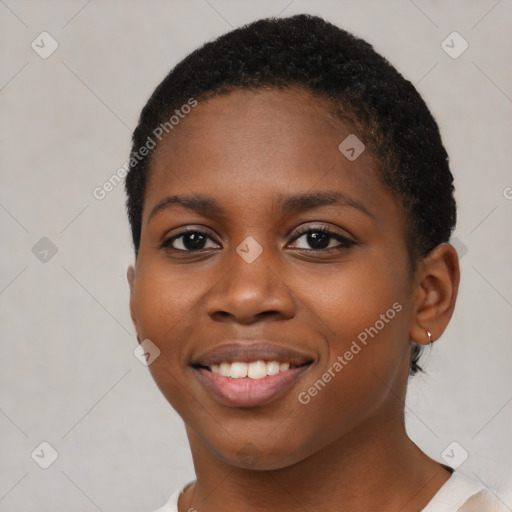 Joyful black young-adult female with short  brown hair and brown eyes