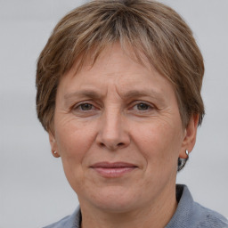 Joyful white adult female with short  brown hair and grey eyes