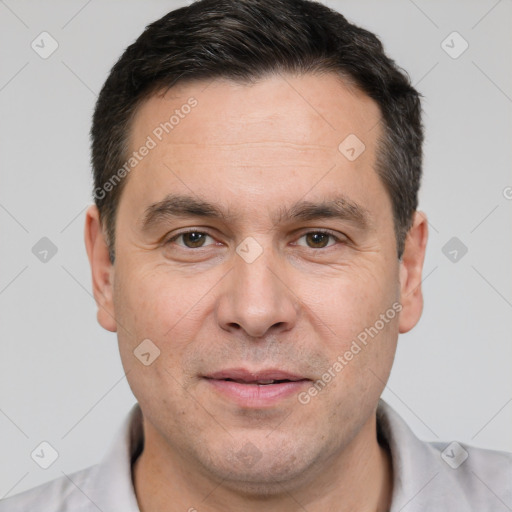 Joyful white adult male with short  brown hair and brown eyes