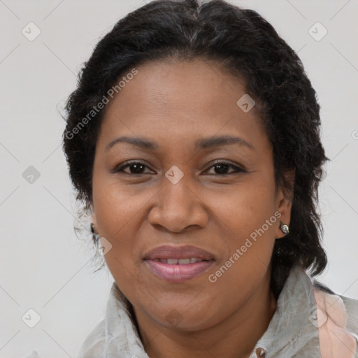 Joyful black adult female with medium  brown hair and brown eyes