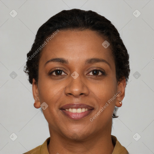 Joyful black young-adult female with short  brown hair and brown eyes