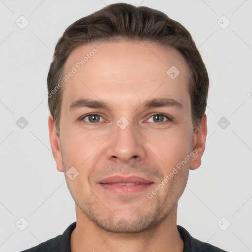 Joyful white adult male with short  brown hair and grey eyes