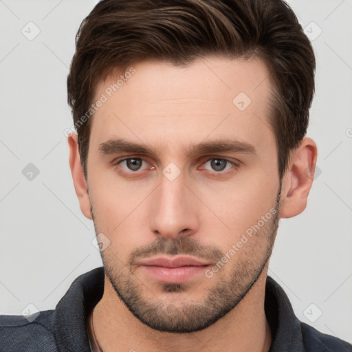 Neutral white young-adult male with short  brown hair and brown eyes