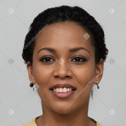 Joyful black young-adult female with short  black hair and brown eyes