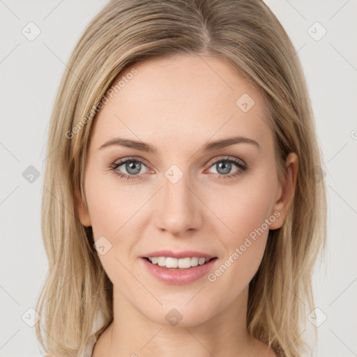 Joyful white young-adult female with long  brown hair and green eyes