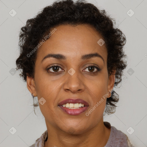 Joyful black adult female with short  brown hair and brown eyes