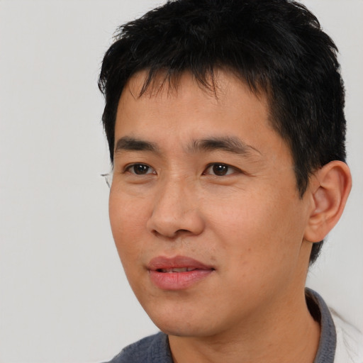 Neutral asian young-adult male with short  black hair and brown eyes