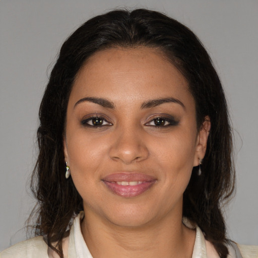 Joyful black young-adult female with medium  brown hair and brown eyes