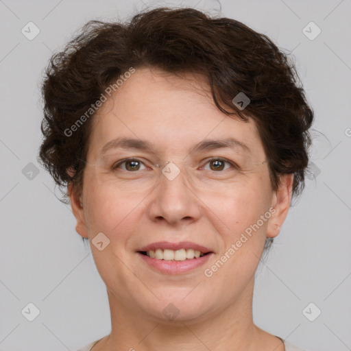 Joyful white adult female with short  brown hair and brown eyes