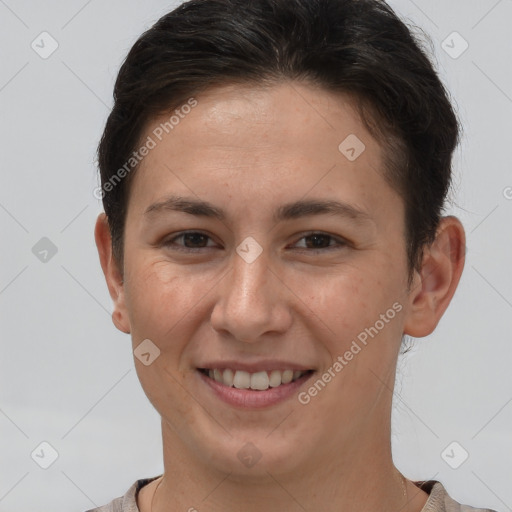 Joyful white young-adult female with short  brown hair and brown eyes