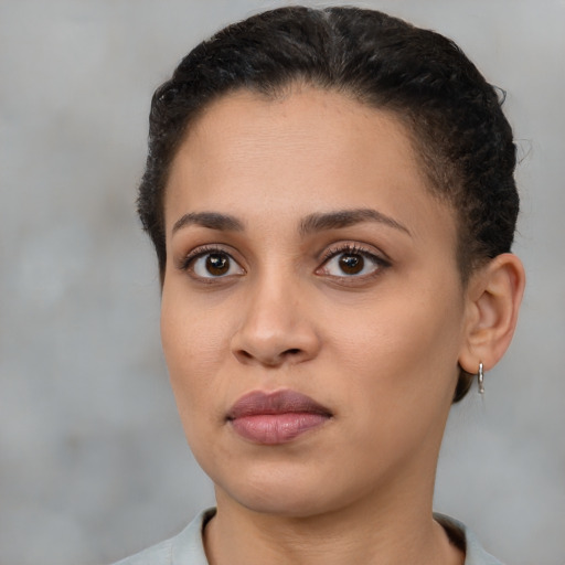 Neutral latino young-adult female with short  brown hair and brown eyes