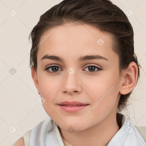 Joyful white child female with short  brown hair and brown eyes