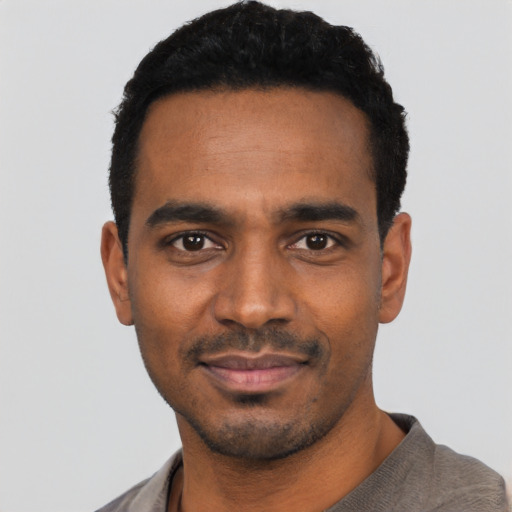 Neutral black young-adult male with short  black hair and brown eyes