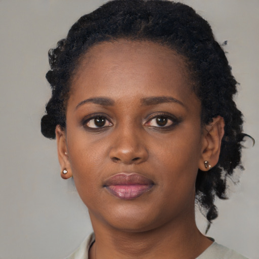Neutral black young-adult female with short  black hair and brown eyes