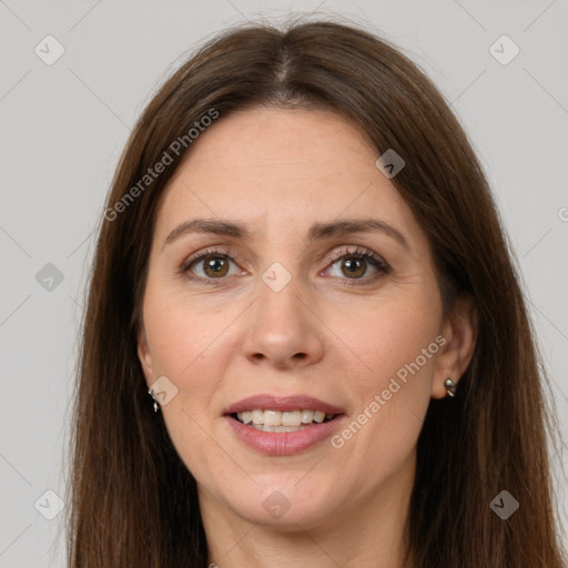 Joyful white adult female with long  brown hair and brown eyes