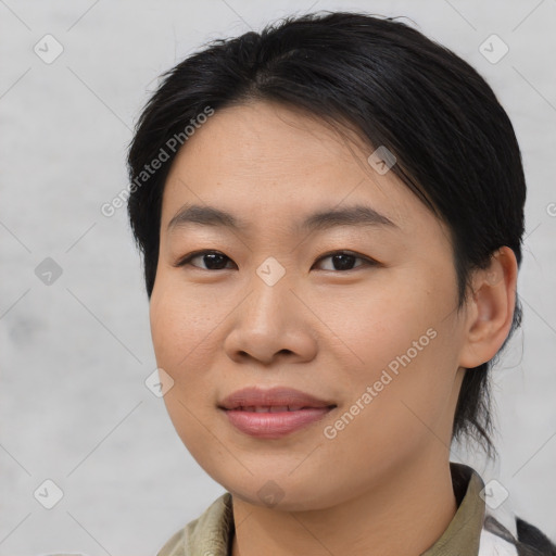 Joyful asian young-adult female with medium  brown hair and brown eyes