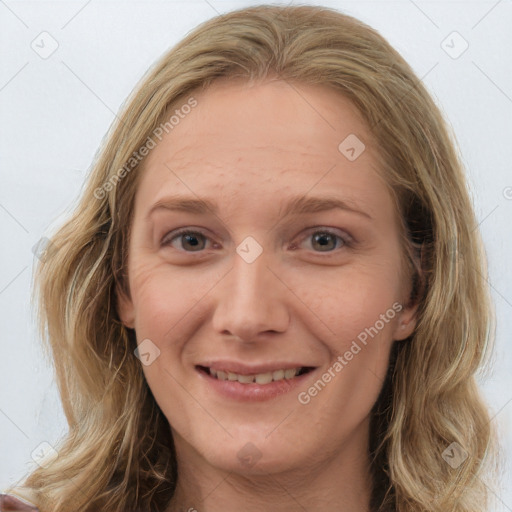 Joyful white young-adult female with medium  brown hair and blue eyes