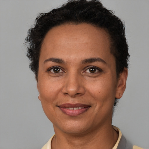 Joyful white adult female with short  brown hair and brown eyes