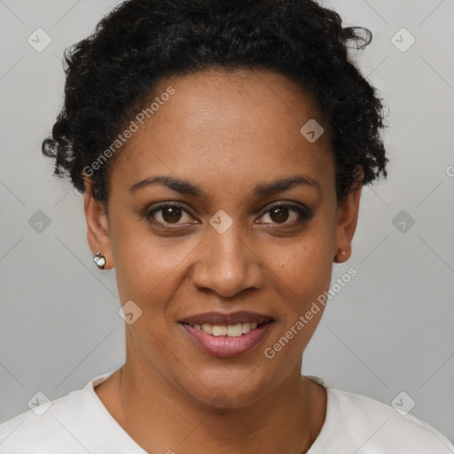 Joyful black young-adult female with short  brown hair and brown eyes